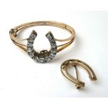An early 20th century yellow metal hinged bracelet set with a detachable horseshoe brooch