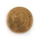 A Swiss 10 Franc gold coin dated 1915