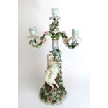 An early 20th century Dresden type porcelain figural candelabra,
