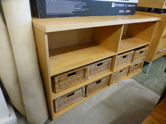A modern sycamore effect storage unit with wicker boxes