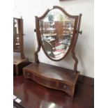 An early 20th century mahogany inlaid shield style toilet mirror