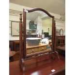 A reproduction swing toilet mirror