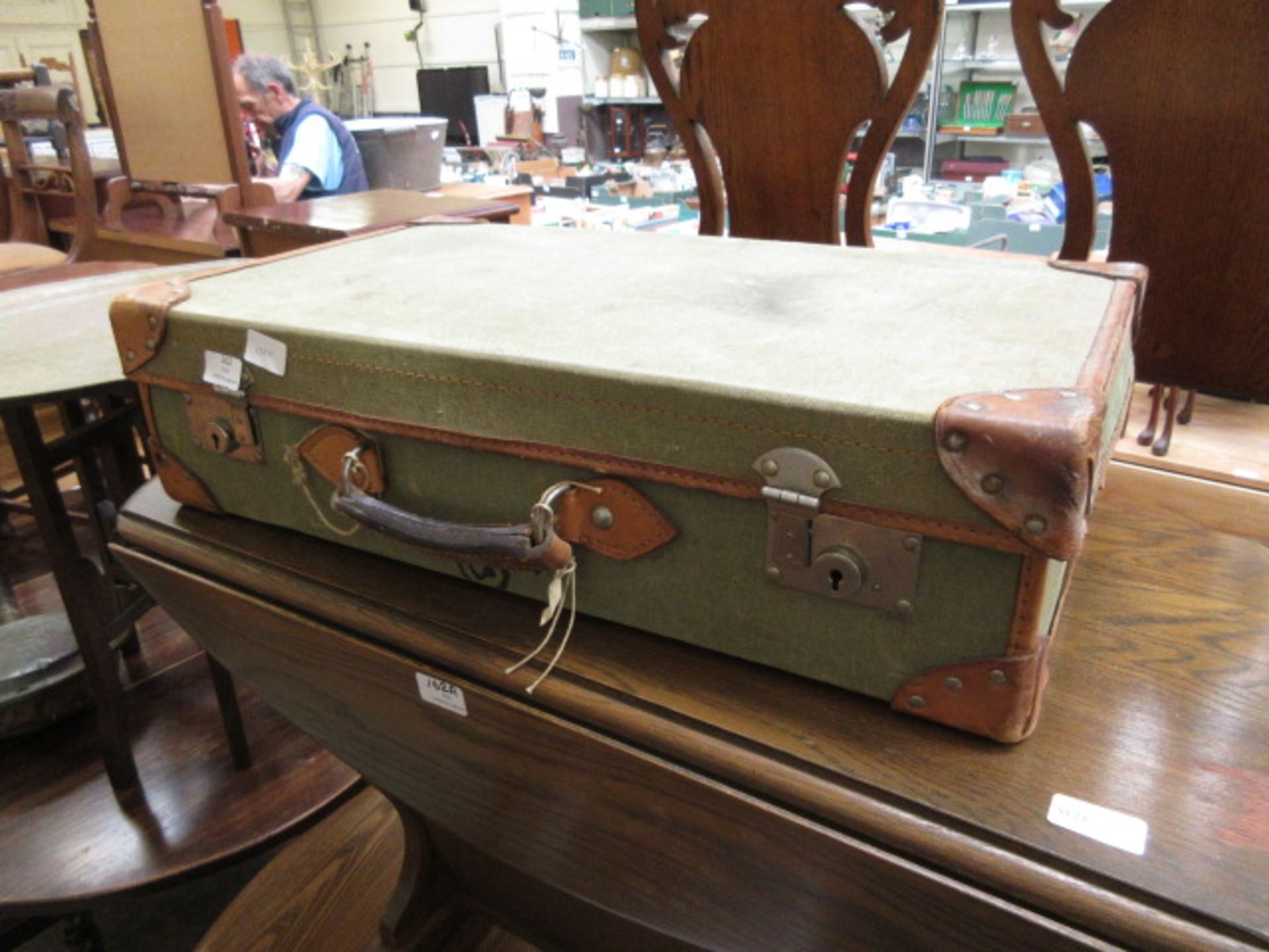 A green leather suitcase