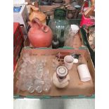 two trays to include drinking vessels, glazed flagon, green glassware etc.