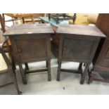 A pair of oak carved fronted single door cabinets