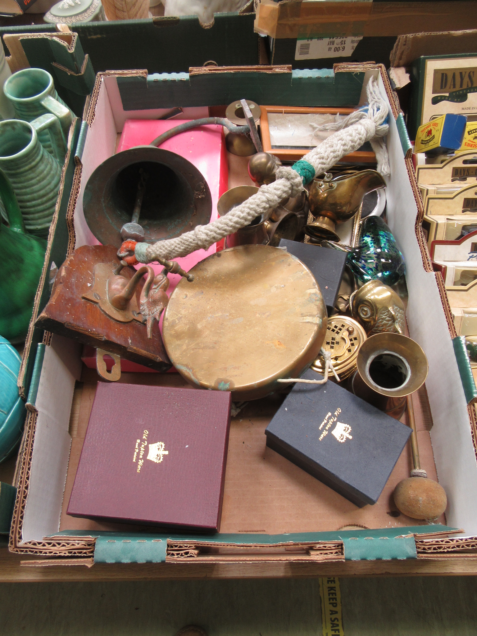 A tray containing a brass Buddha, door bell, gong etc.