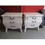 A pair of reproduction white laminated cushion fronted three drawer bedside chests