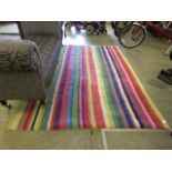 A multi-coloured striped wool rug