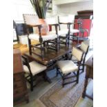 A set of four plus two oak dining chairs with a cream leatherette studded upholstery