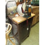 A Black & Decker grinder on oak cupboard