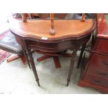 A reproduction mahogany demi lune hall table