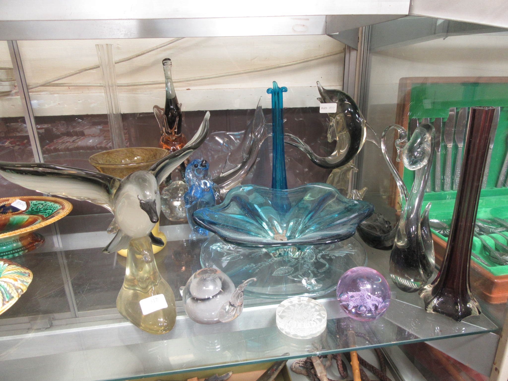 A quantity of glass animals, bowls, paperweights etc.