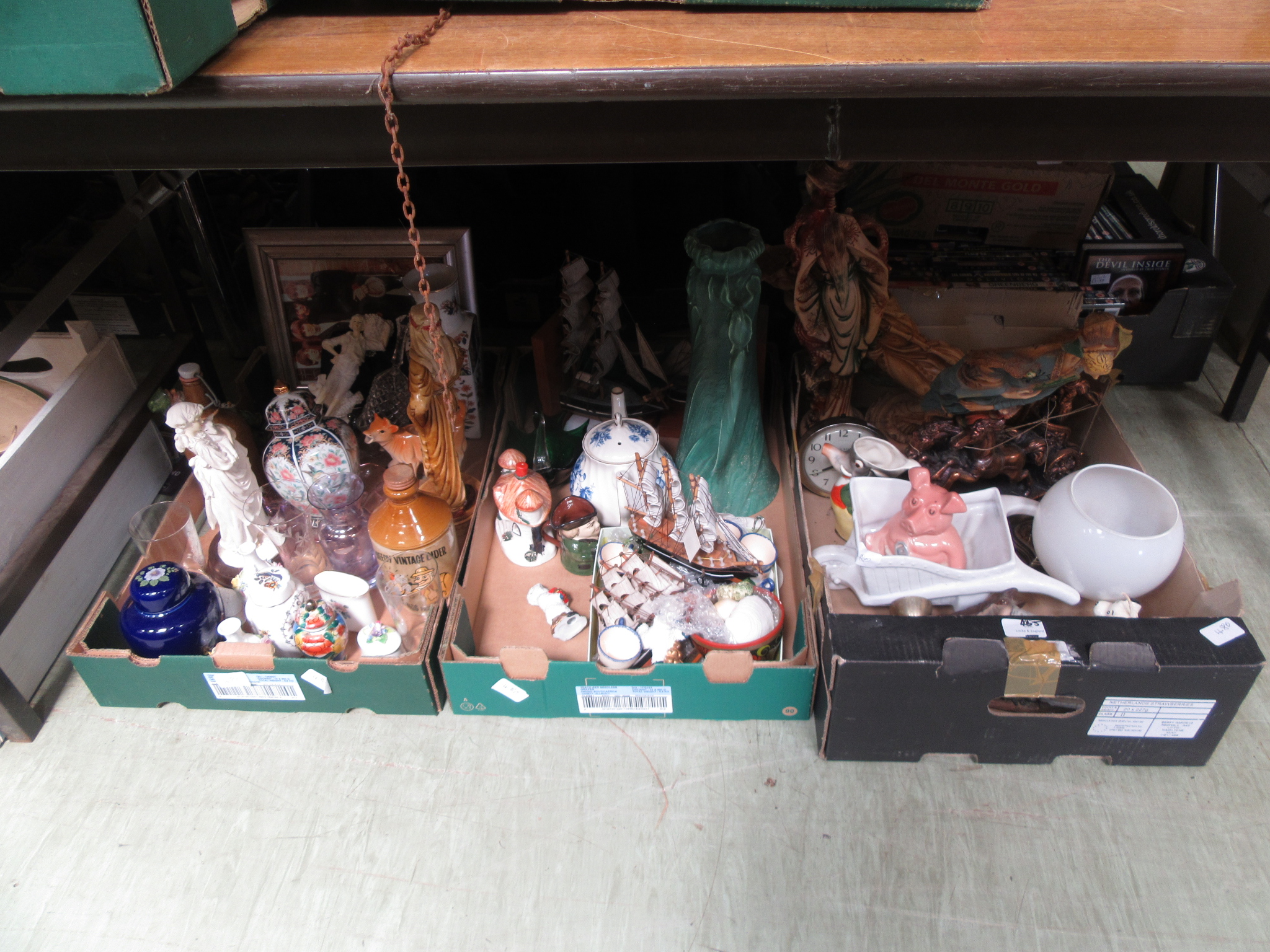 Three trays of decorative ceramic ware to include figurines, Wade money box etc.