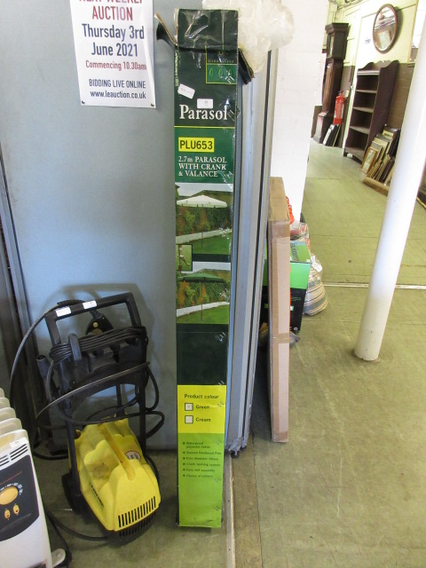 A boxed green parasol