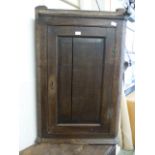 An early 18th century oak wall hanging corner cupboard (for restoration)