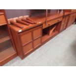 A mid-20th century teak sideboard having later detachable legs