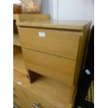 A modern oak veneered bedside chest of two drawers