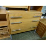 A modern sycamore effect three drawer chest