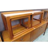 A mid-20th century teak nest of tables