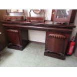 A 19th century mahogany twin pedestal sideboard, the top over three drawers on the pedestals with