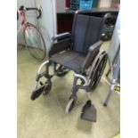 A black tubular folding wheelchair