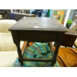 A 19th century carved oak table with storage under top