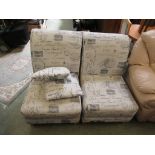 A pair of modern chairs with postal mark design with two scatter cushions