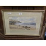 A framed and glazed coastal scene print of North Devon signed in pencil