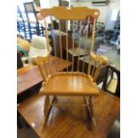 A modern beech and ply rocking chair