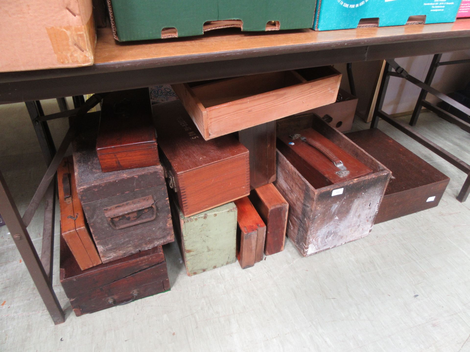 A large assortment of wooden boxes