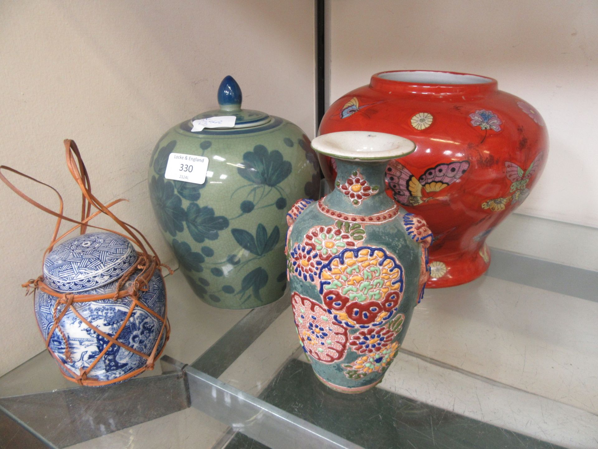 A selection of oriental ceramics to include Japanese satsuma vase, lidded jar, butterfly vase etc.