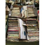 Two trays of 7 inch singles by various artists to include New Kids on the Block, Roachford,