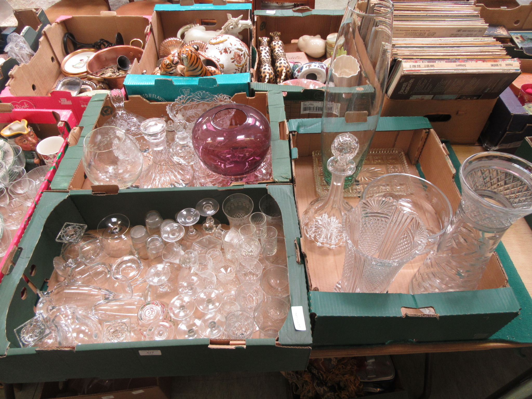 Three trays of assorted glassware to include vases, port glasses, decanter etc.