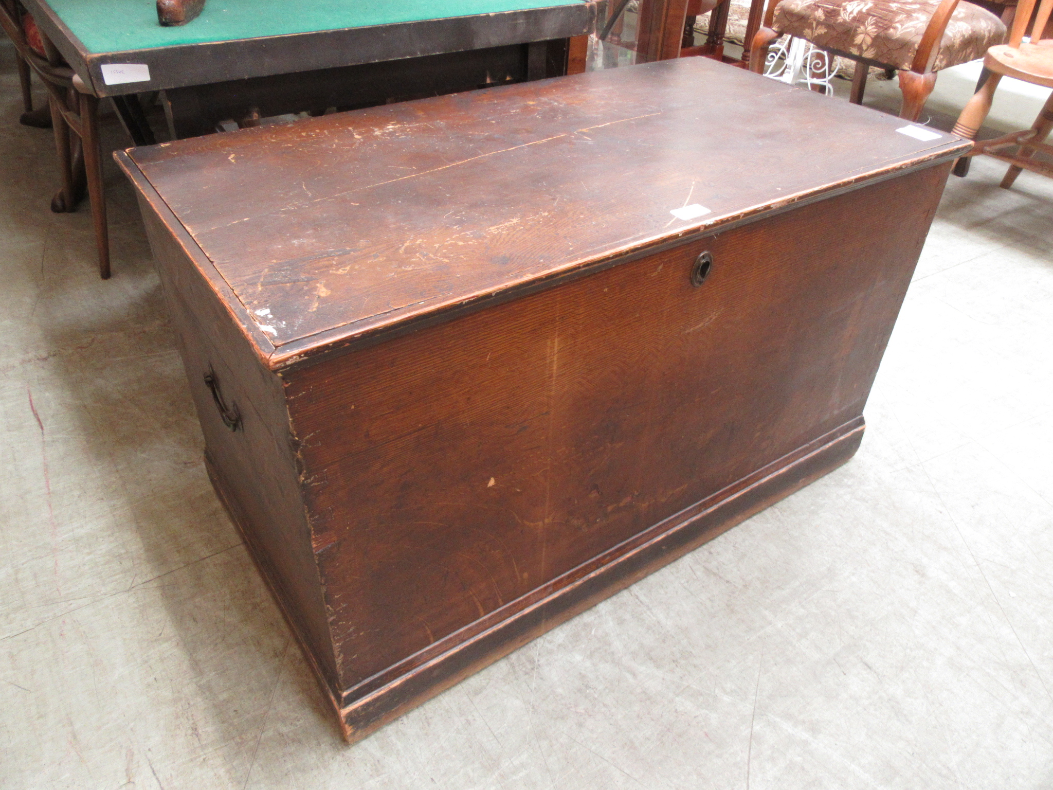 A 19th century scumbled pine travelling trunk