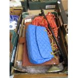 A tray containing a blue handbag, briefcase, jewellery stand, tie backs, cup hooks etc.