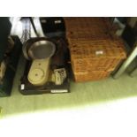 A wicker basket together with a tray of kitchenalia