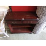 A reproduction mahogany hall cabinet having two drawers above open storage