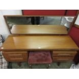 A mid-20th century teak G Plan dressing table having pedestals of two drawers with pull out drawer