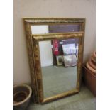 Two modern decorative framed wall mirrors