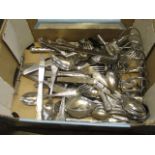 An assortment of silver plated flatware and a toast rack