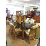 A modern rectangular smoked glass topped bamboo supported dining table with a set of six matching