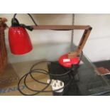 A mid-20th century red angle poise style lamp