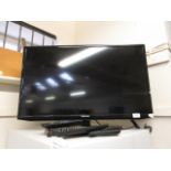 A Samsung flat screen television receiver with remote