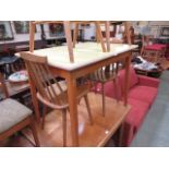 A yellow Formica topped kitchen table