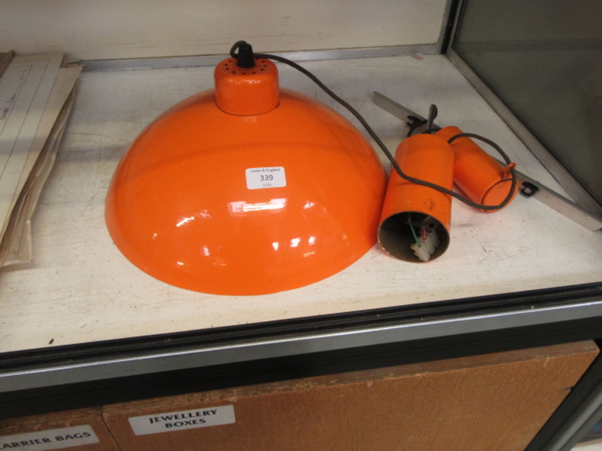 A mid-20th century orange ceiling light