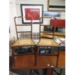 A pair of early 20th century bergere seated bedroom chairs