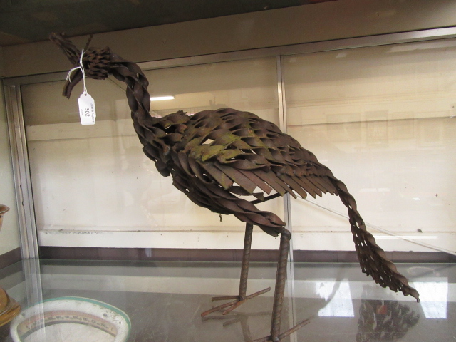 A modern metalwork sculpture of a bird