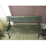 A green painted garden bench