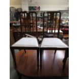 A pair of early 20th century mahogany bedroom chairs