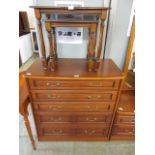 A modern cherry wood effect chest of five long drawers